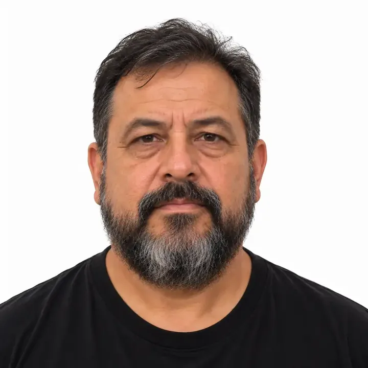 Joshua Rivera – Founder & Owner Joshua Rivera, 55-year-old roofing company owner with a full beard.